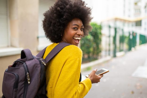 Woman walking outside Boston, Massachusetts after receiving outpatient rehab treatment
